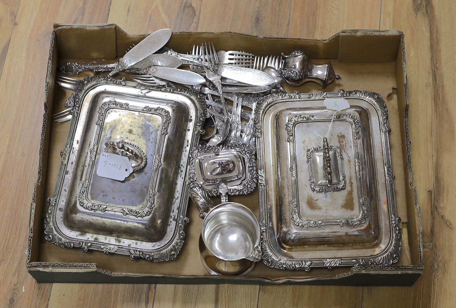 A pair of Sheffield plate entree dishes and other minor plated items including flatware.